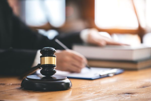judge with hammer lawyer justice a businessman in a suit or a lawyer working on paperwork Legal concepts, advice and justice